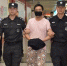犯罪嫌疑人蒋某某被押解回国。　周尔博（通讯员）　摄 - 浙江新闻网